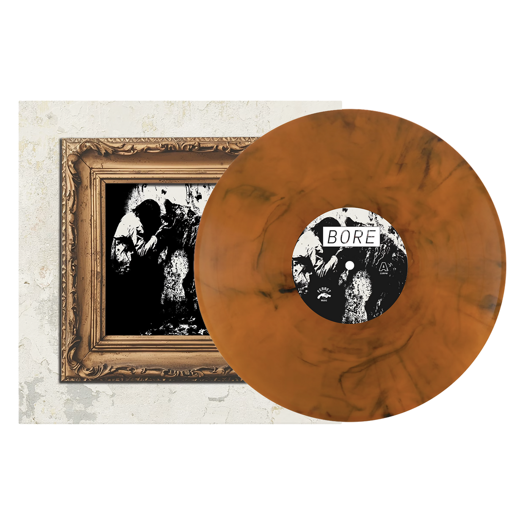 A limited edition Feral - Orange Smoke LP is shown in striking orange and black marbled vinyl with a white label marked “BORE.” Displayed next to its cover, which features a framed black-and-white illustration, this Ferret first pressing is an essential rare find for collectors seeking unique vinyl pressing info.