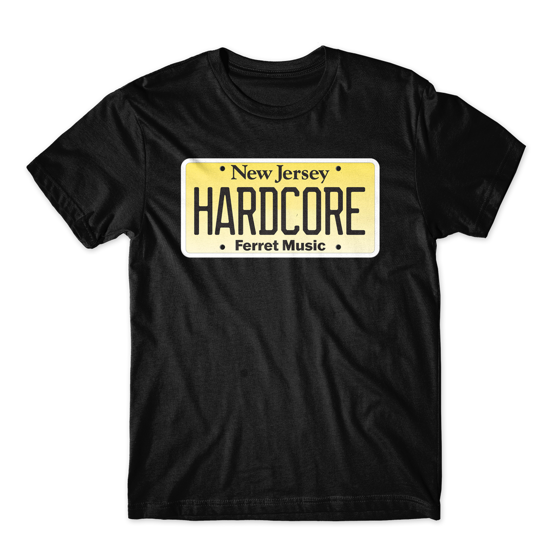 The Alive & Well - Black T-Shirt is a regular fit combed cotton tee featuring a graphic of a yellow New Jersey license plate with “HARDCORE” and “Ferret Music” printed underneath. This design is printed on the premium ASColour 5001 for lasting comfort and style.