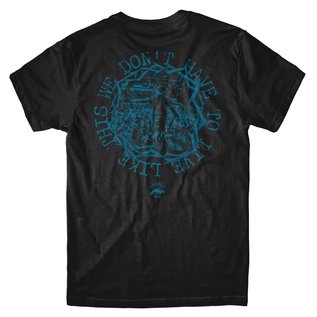 Back view of a Live Shot - Black T-Shirt featuring a blue circular graphic of a concert crowd, a microphone, and the text THIS WE DONT HAVE TO LIVE LIKE.